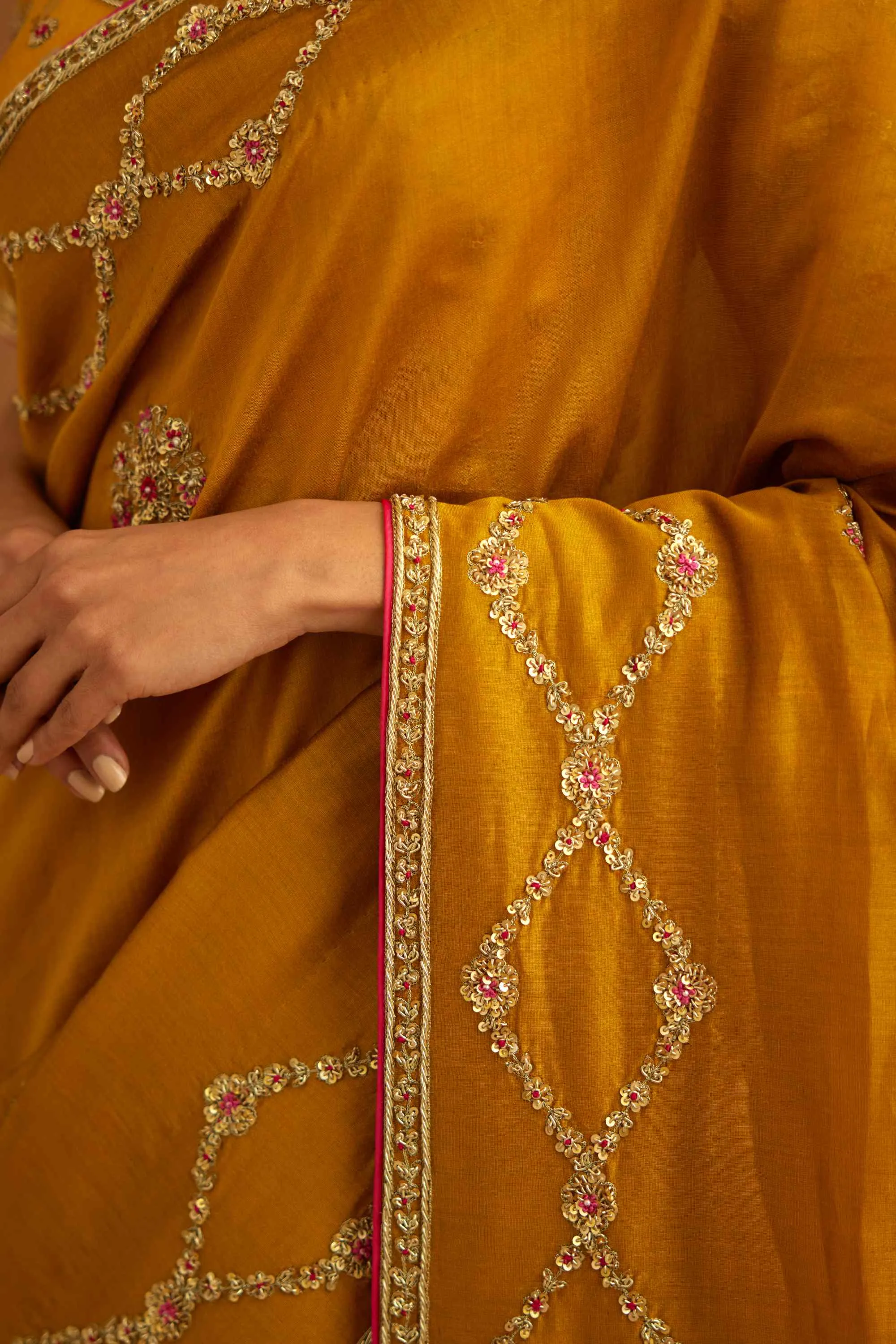 Mustard yellow zardozi sari and blouse